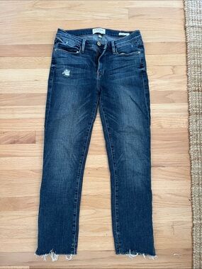 Frame Denim Skinny Jeans in Dark Blue Wash with Raw Hem
